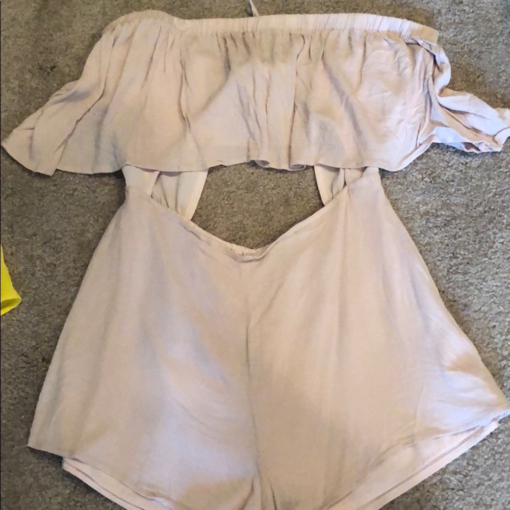 Blush romper.Off shoulder.Ties in back.Front slit